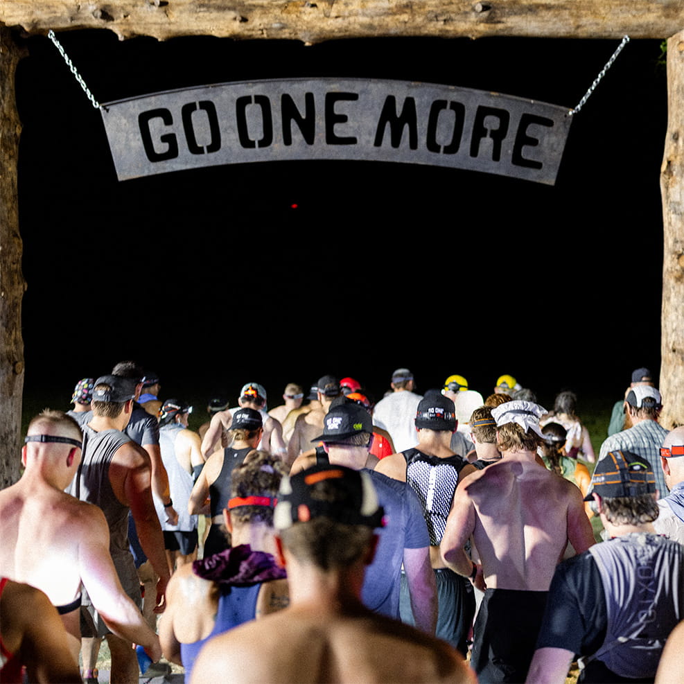 Runners heading out under the Go One More sign at the BPN Backyard Ultra